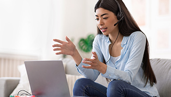 Young woman talking on headset